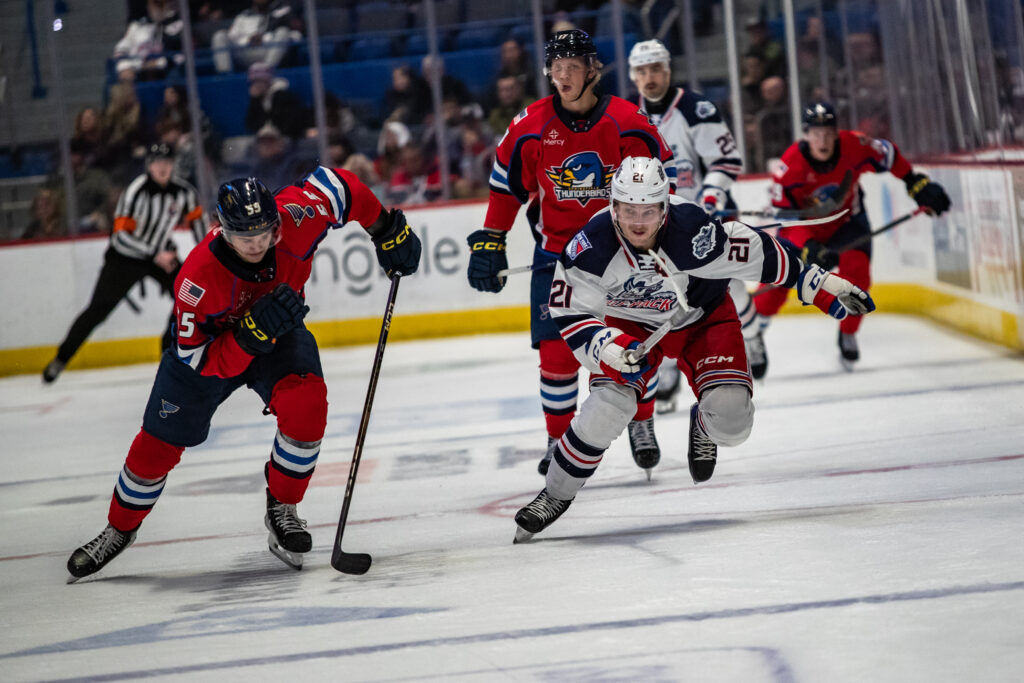 Anton Blidh of the Hartford Wolf Pack chases down Hunter Skinner of the Springfield Thunderbirds.