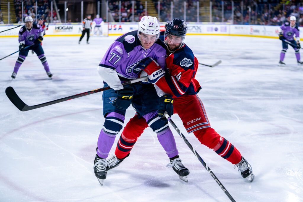 Connor Mackey of the Hartford Wolf Pack hits Drew Callin of the Springfield Thunderbirds, 11/30/24.