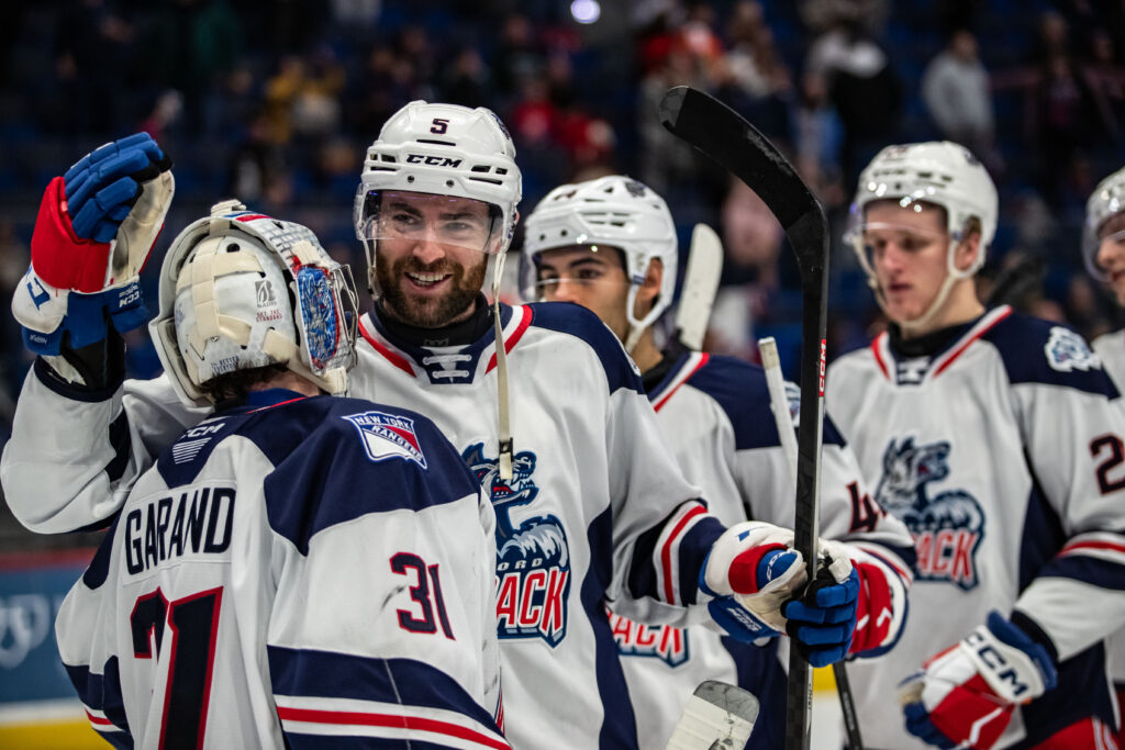 Ben Harpur and Dylan Garand celebrate a Hartford Wolf Pack victory, 12/14/24.